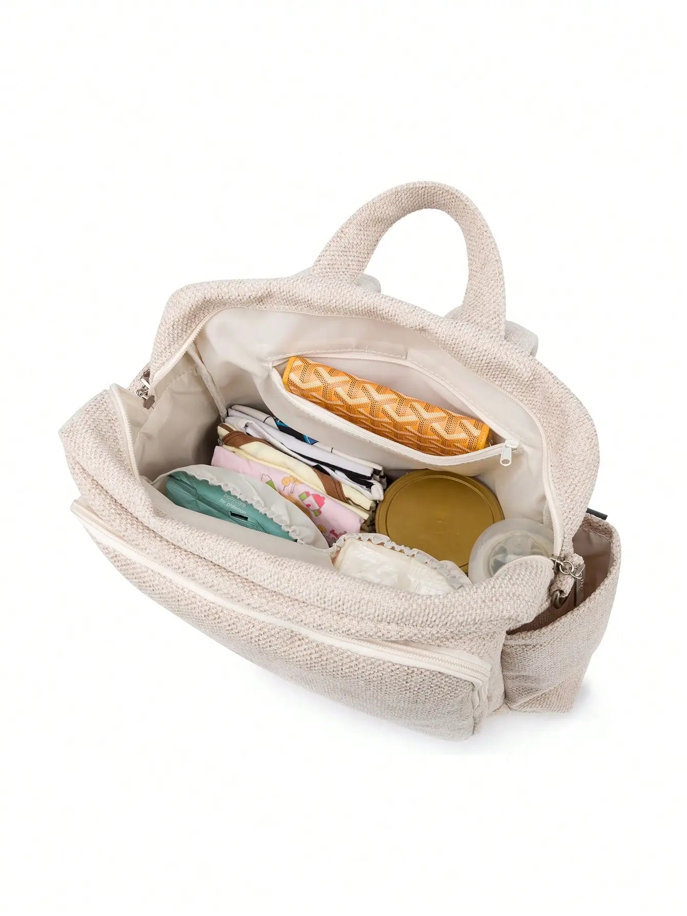 Sac à langer design raffiné en simili cuir et tissu texturé, parfait pour les parents urbains.