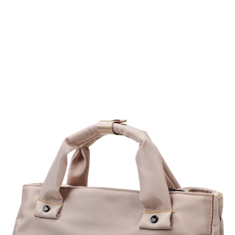 Sac à langer Noa ouvert montrant compartiment pour linge mouillé et poches multiples pratiques