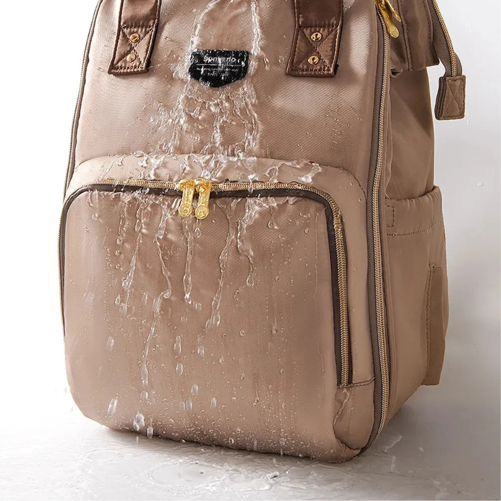sac à langé bébé et organisation intérieure du sac à langer moka avec 15 poches