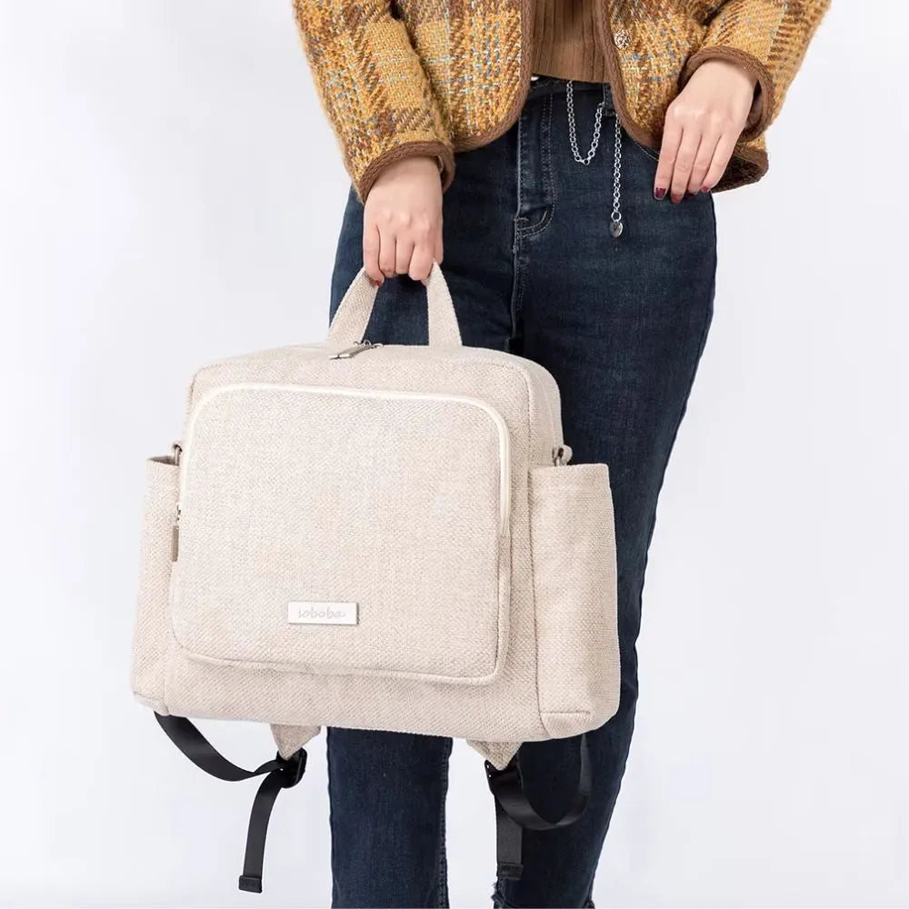 Sac à langer moderne léger 0,72 kg, format 34x32x12 cm, idéal pour organiser les affaires de bébé.