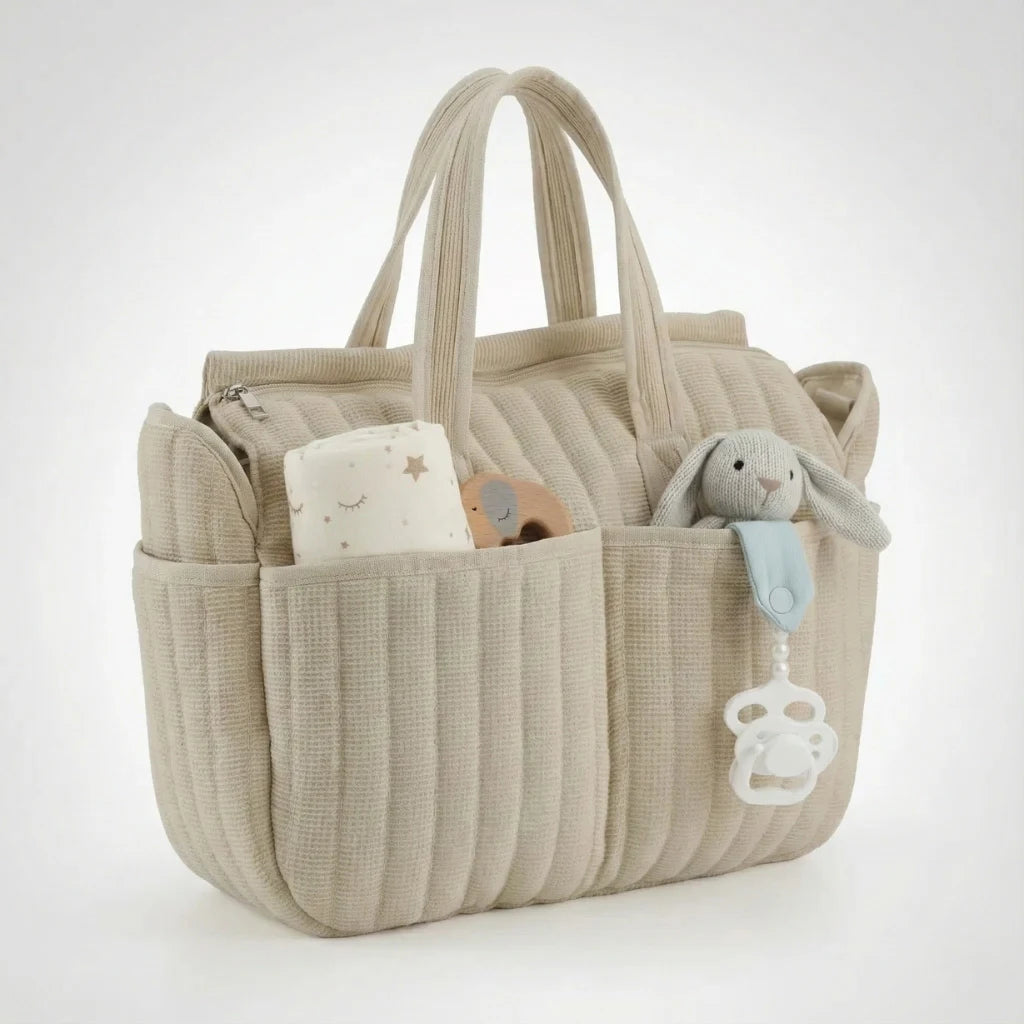 Sac à langer bébé style cosy en coton matelassé avec organisation optimale et port confortable à l’épaule