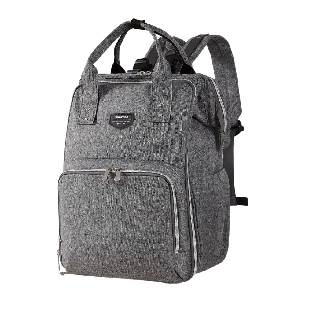 Sac à langer dos Moka élégant et léger, accroché à une poussette, idéal pour les sorties quotidiennes et le voyage avec bébé.