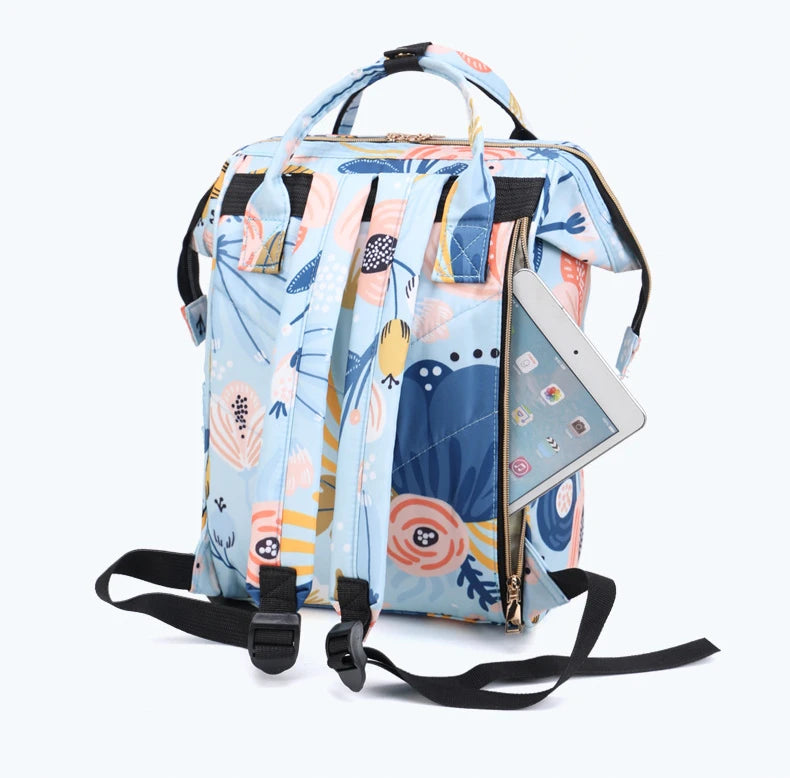 Sac à langer tendance avec espace pour linge et accessoires