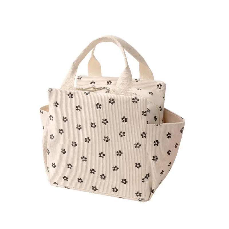 Sac lunch Sweet Pouch beige motif fleur, vue latérale avec poignée de transport, deux poches gauche et droite pour gourde ou gobelet ou parapluie