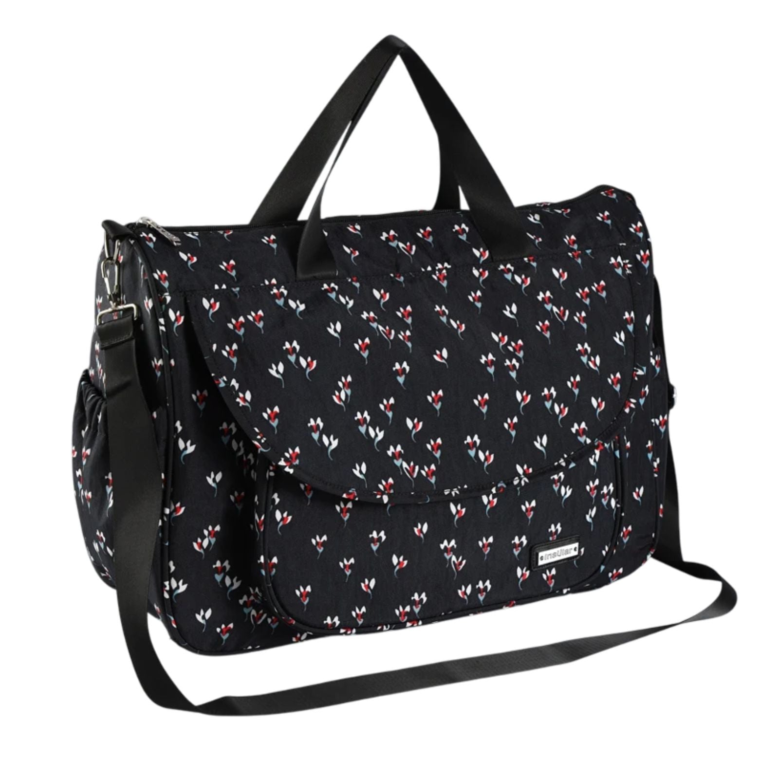 Sac à langer Linoa posé sur une table en bois dans un décor naturel