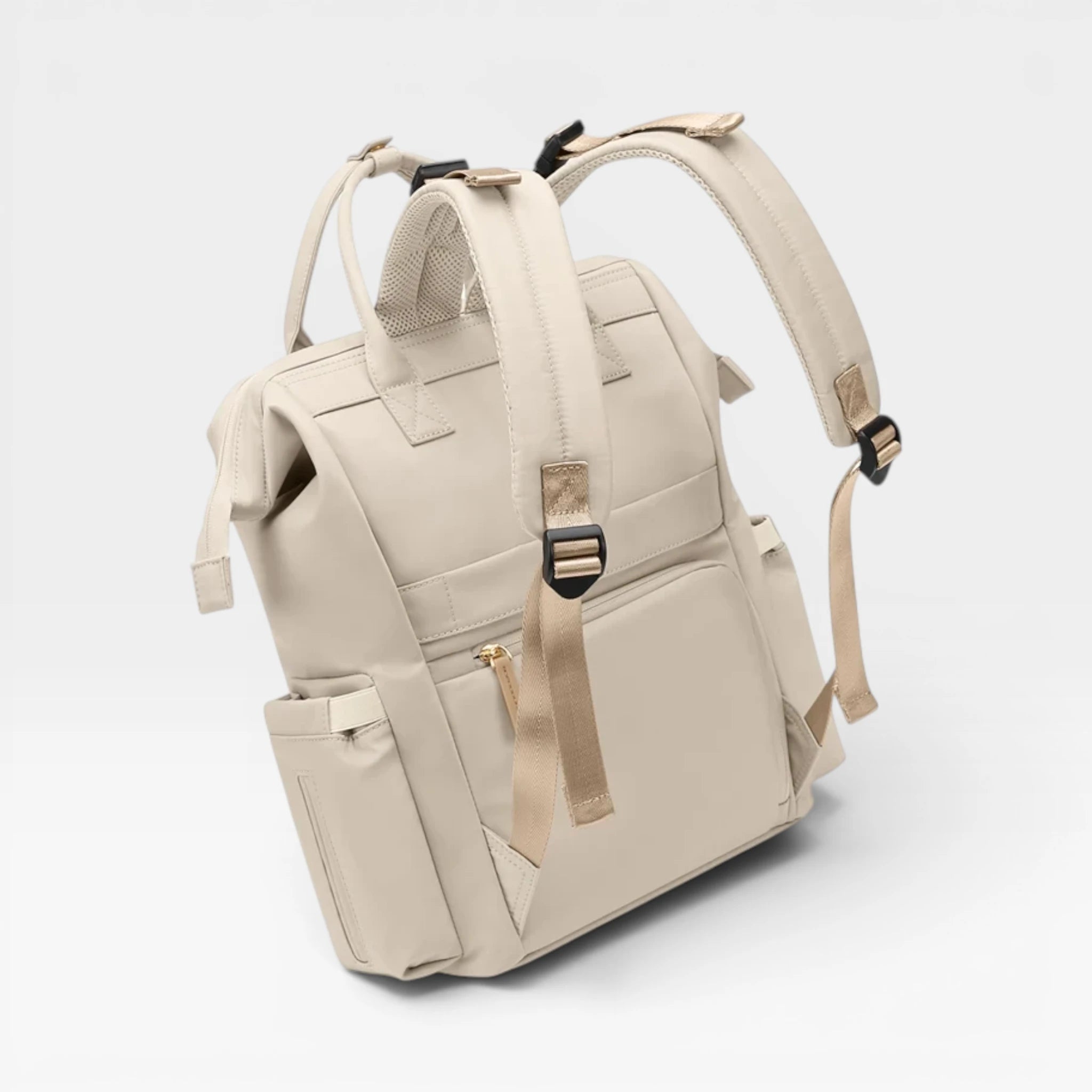 Dos du sac à langer avec sangle d'insertion pour valise, parfait pour les voyages en avion et train.