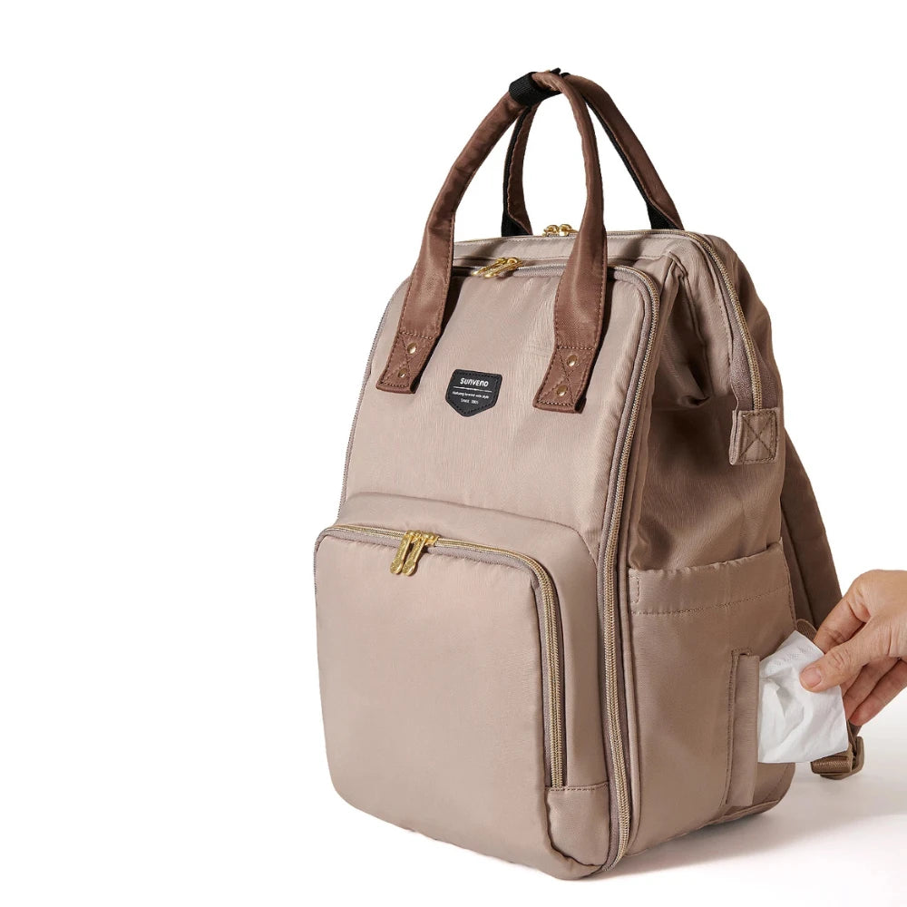 sangle valise du sac à langer moka pour un voyage pratique
