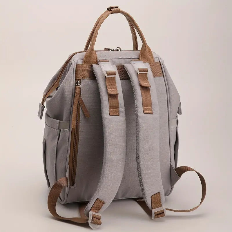 Sac à dos sac à langer fonctionnel en tissu canvas résistant

