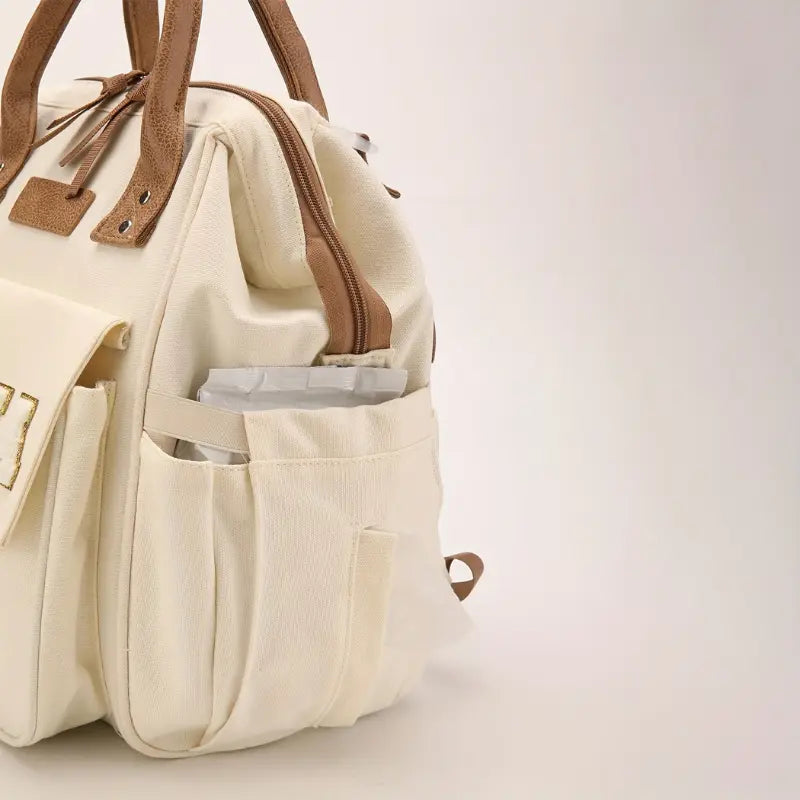 Sac à langer sac à dos en canvas pour parents modernes et actifs

