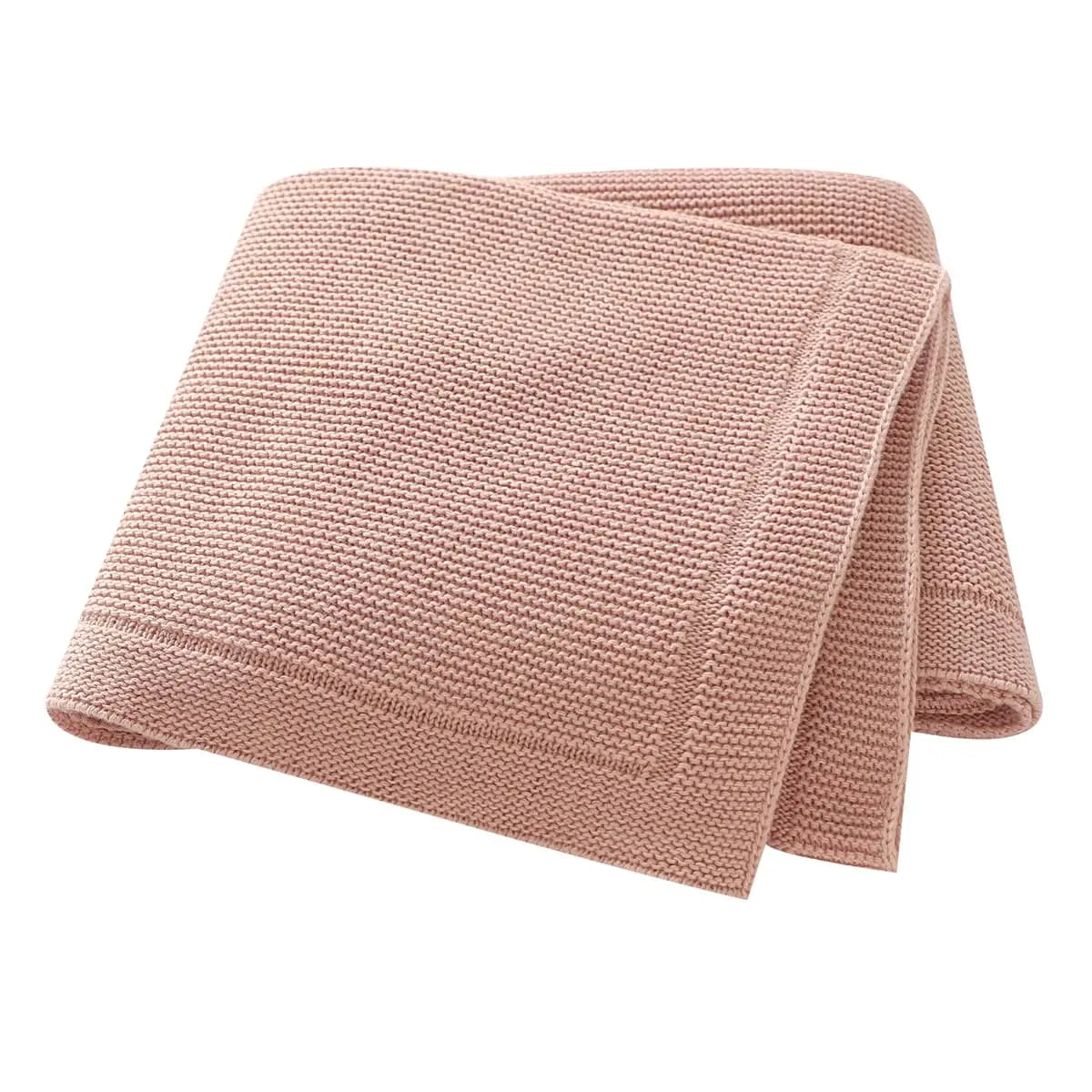 Couverture tricotée bébé GoodKnit utilisée comme tapis de jeu douillet