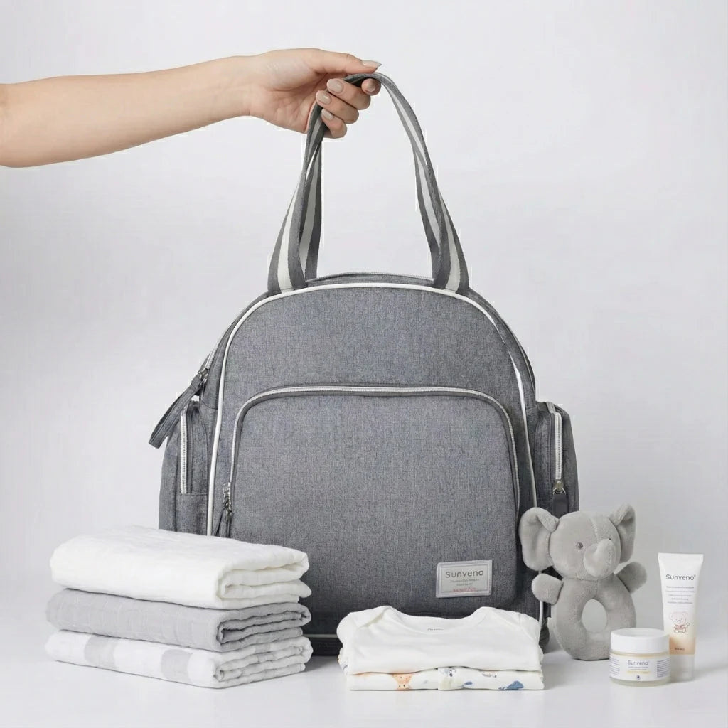 Sac à langer NomadGlow grande capacité avec 13 poches et organisation intelligente pour sorties avec bébé