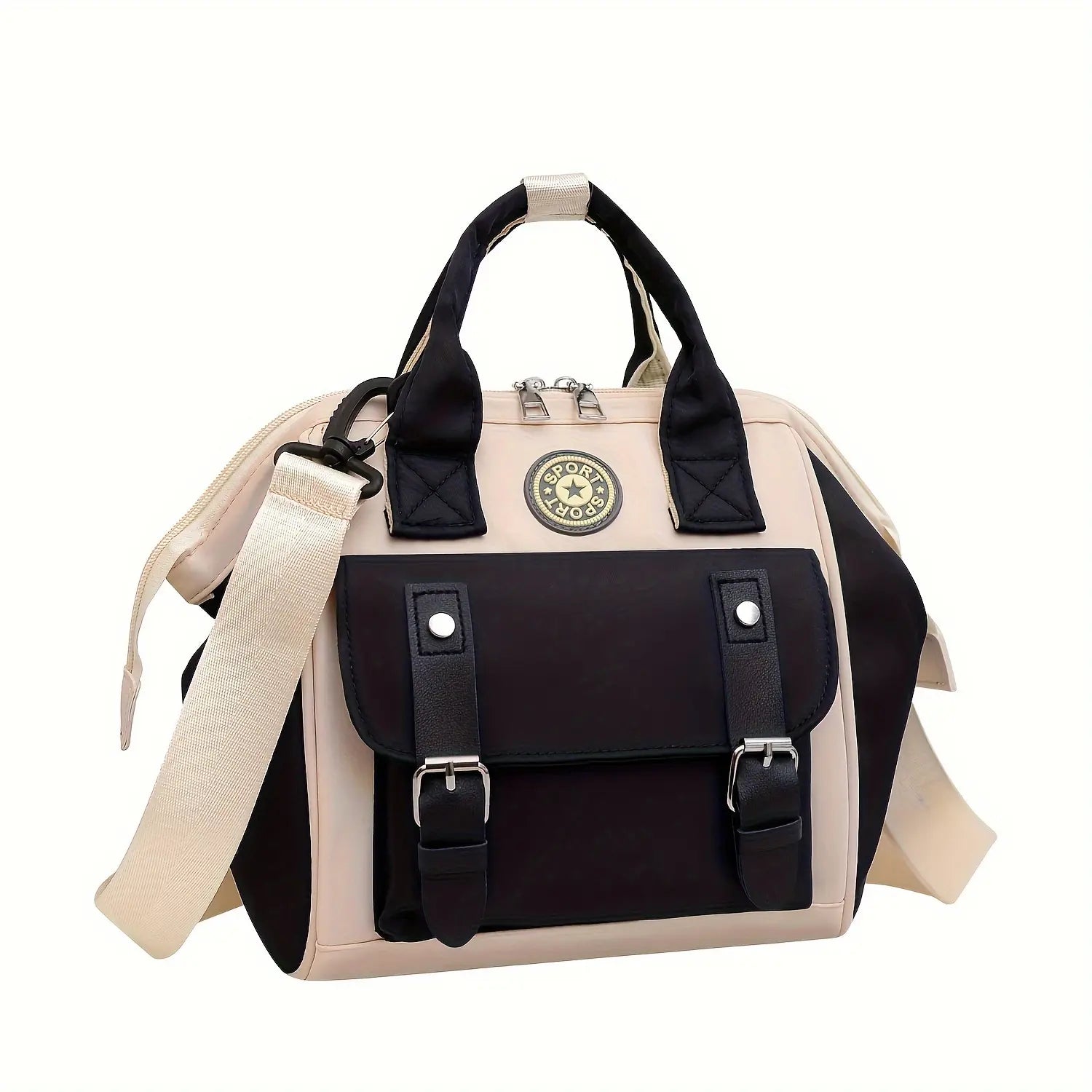 Sac à langer Mini CHIC compact en nylon noir posé sur une table en bois

